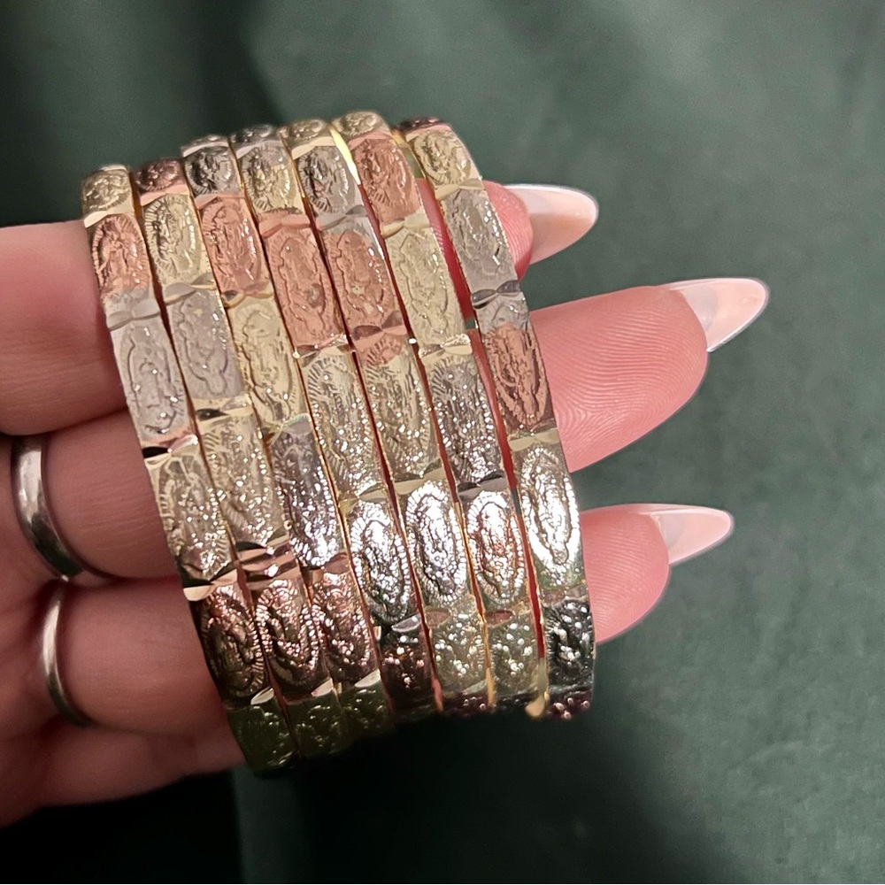 7 piece gold PLATED Virgin Mary Guadalupe bangle set.